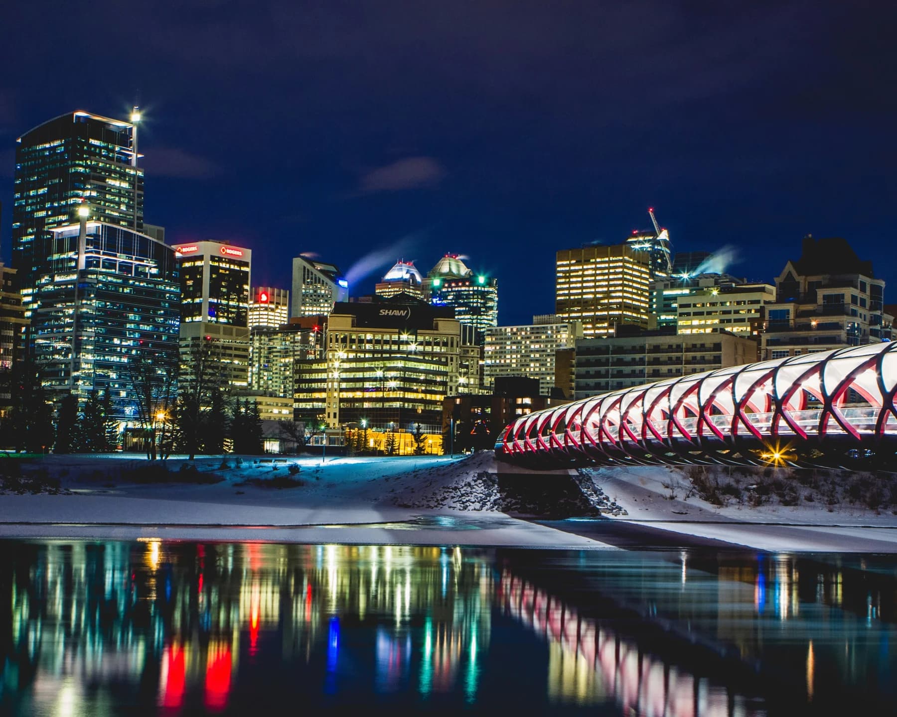 Calgary’s lights reflected in the river at night