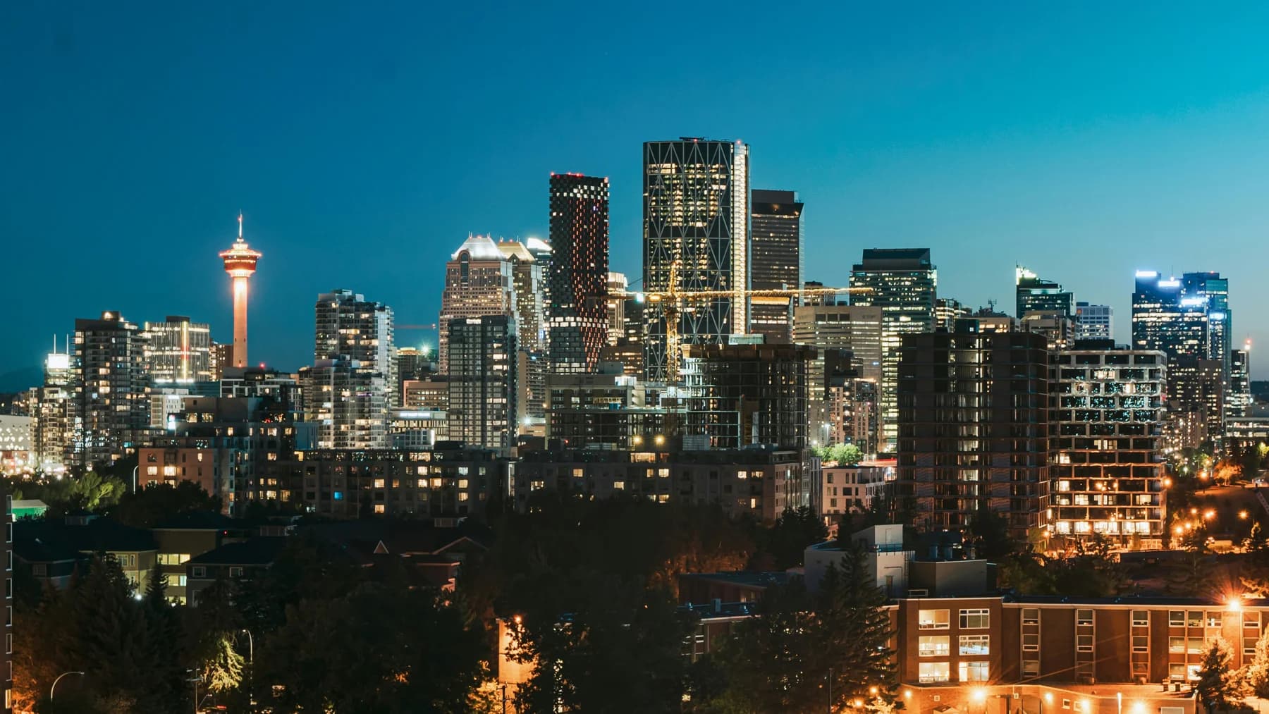 Calgary’s skyline illuminated against the evening sky