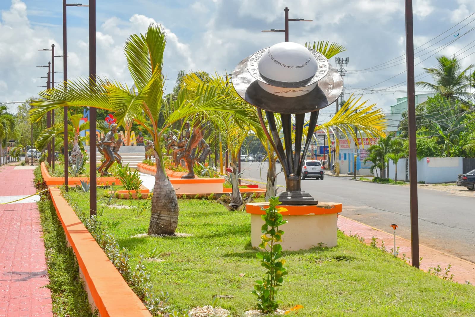 A hat-shaped sculpture in a landscaped public space