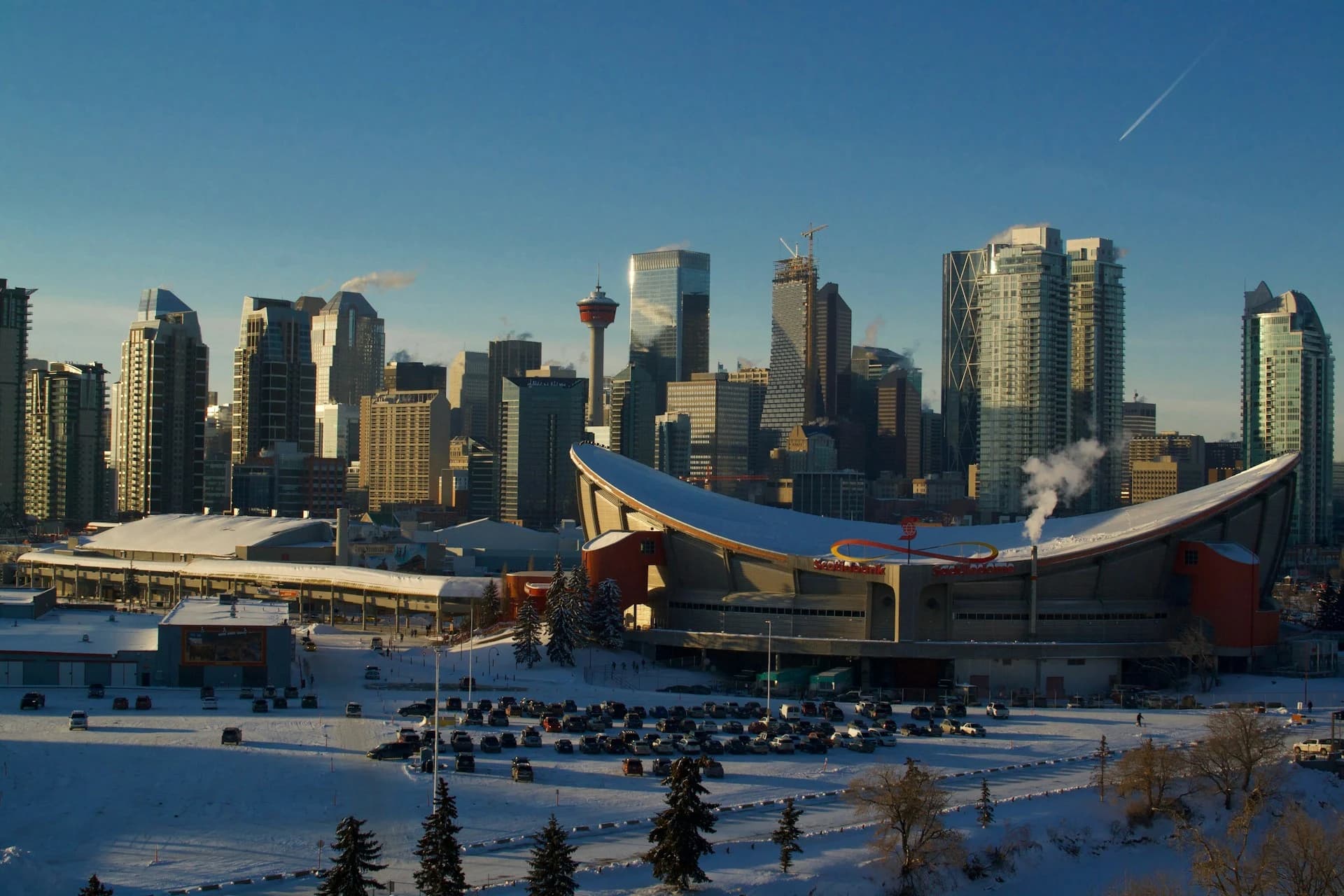 Calgary Tower and the Saddledome against the city skyline in winter