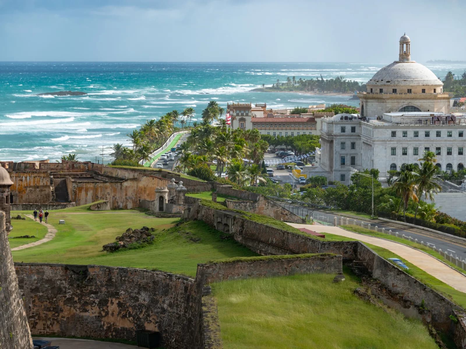 The domed Capitol of Puerto Rico beside the old walls and the Atlantic coast