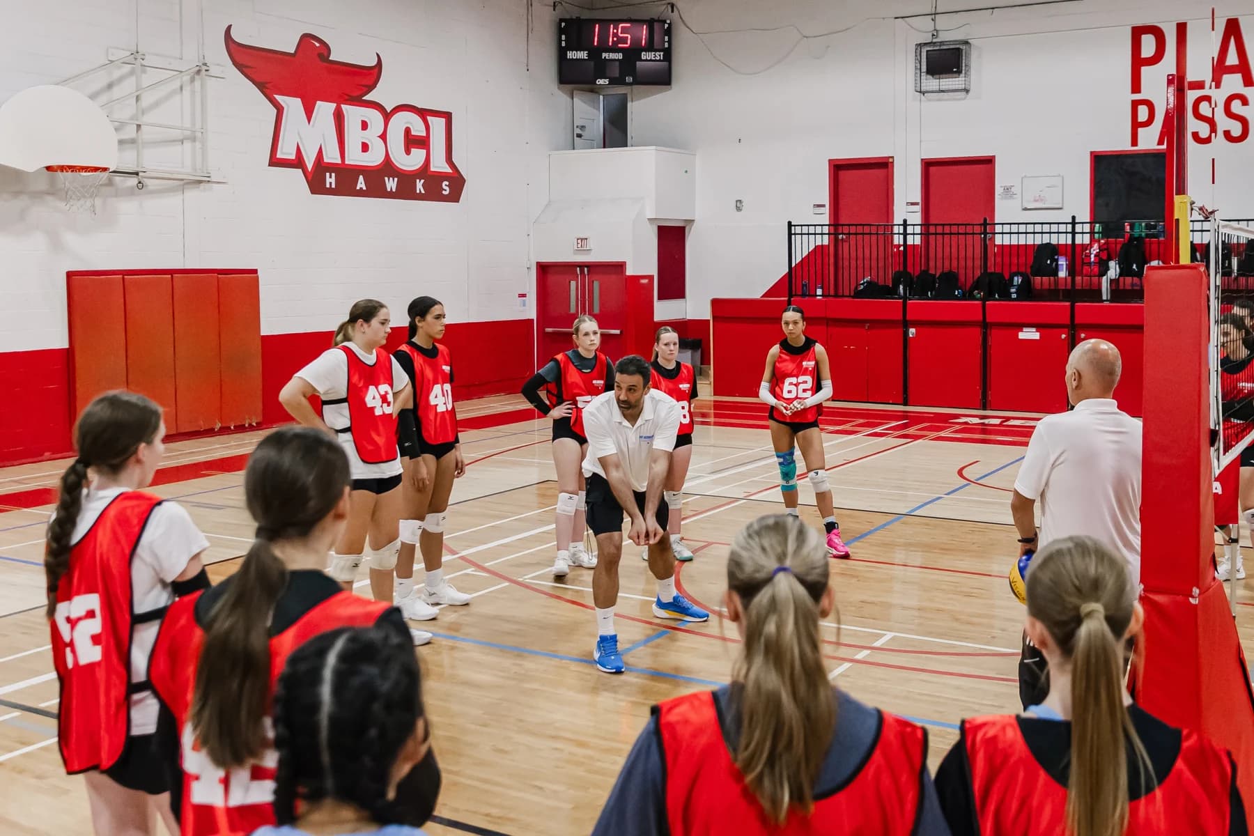 Girls competing in a volleyball match at a past Vision showcase