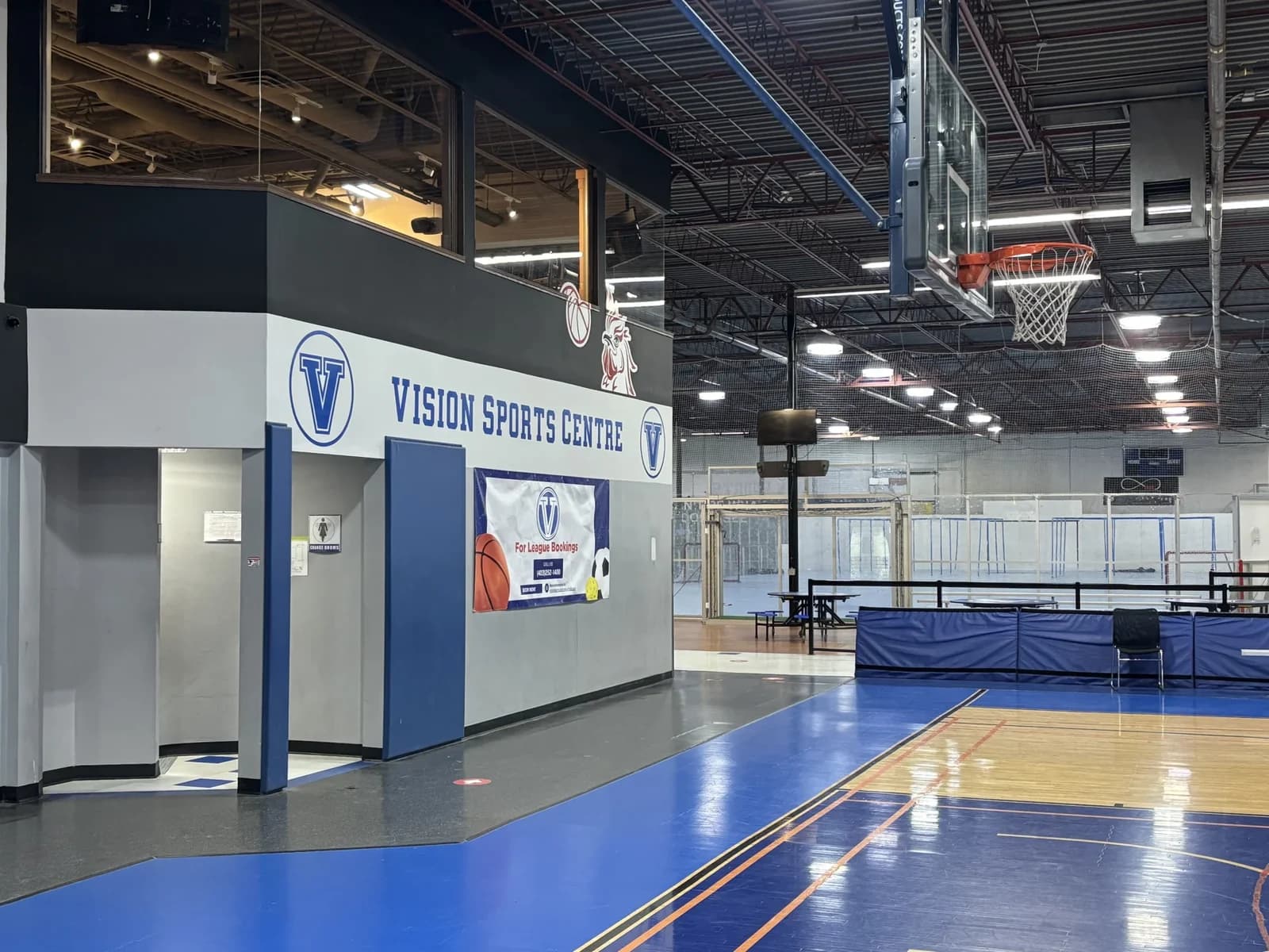 Vision Sport Centre signage beside its indoor sports courts