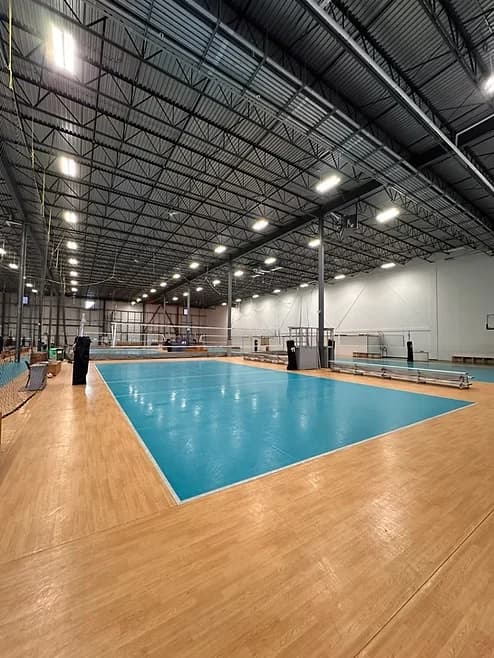 A volleyball court inside the Volleydome gym