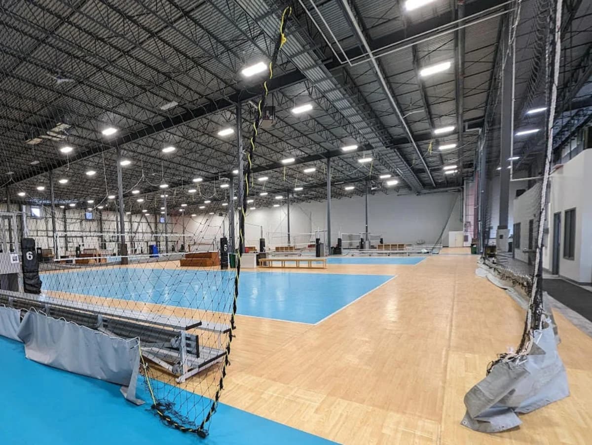 Several volleyball courts with dividing nets at Volleydome
